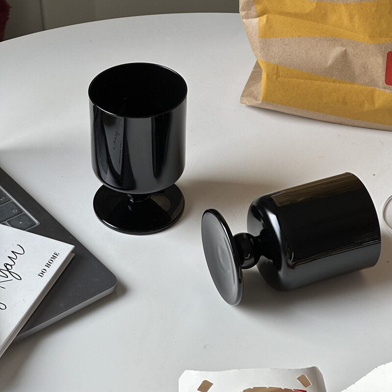 black stemmed glass